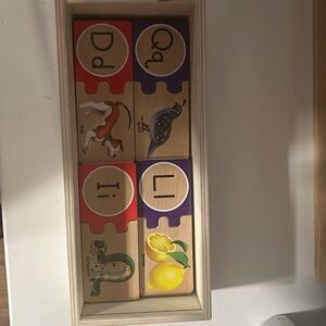 Melissa and Doug letter puzzle. Wooden box with lid. None missing